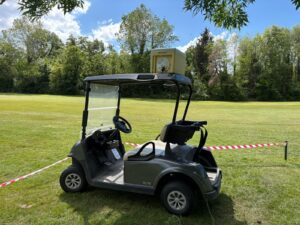 Golf buggy with falconry bird box for pest control on golf course